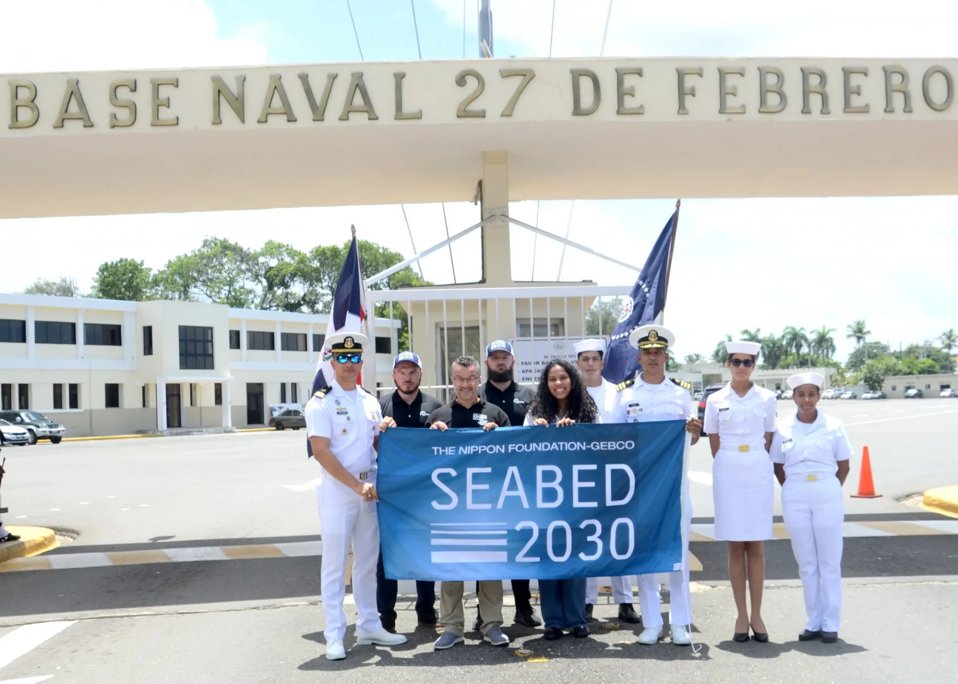 Members of Seabed 2030, TCarta and the Dominican Navy holding the Seabed 2030 Flag. 